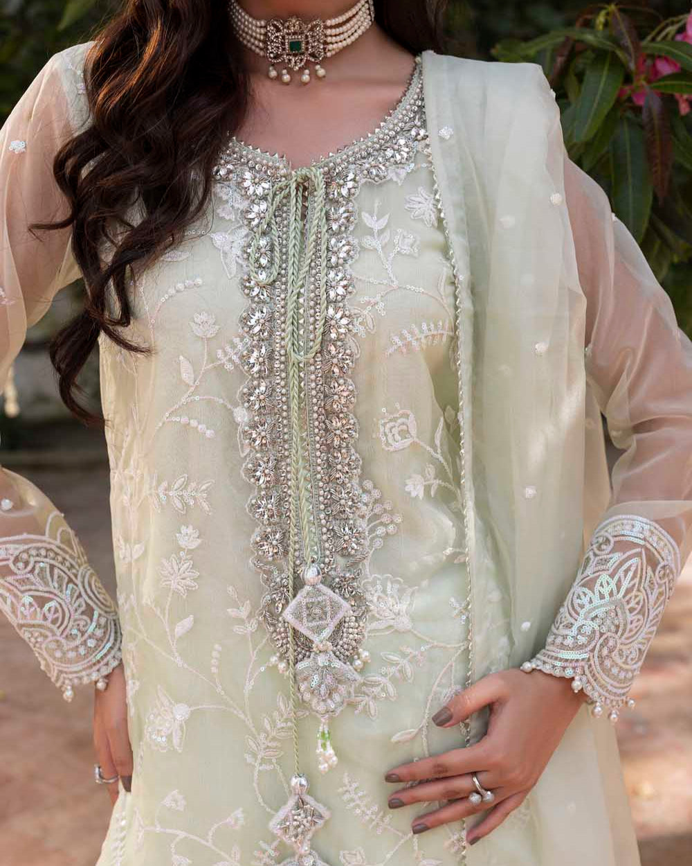 Light green embroidered traditional outfit with intricate designs